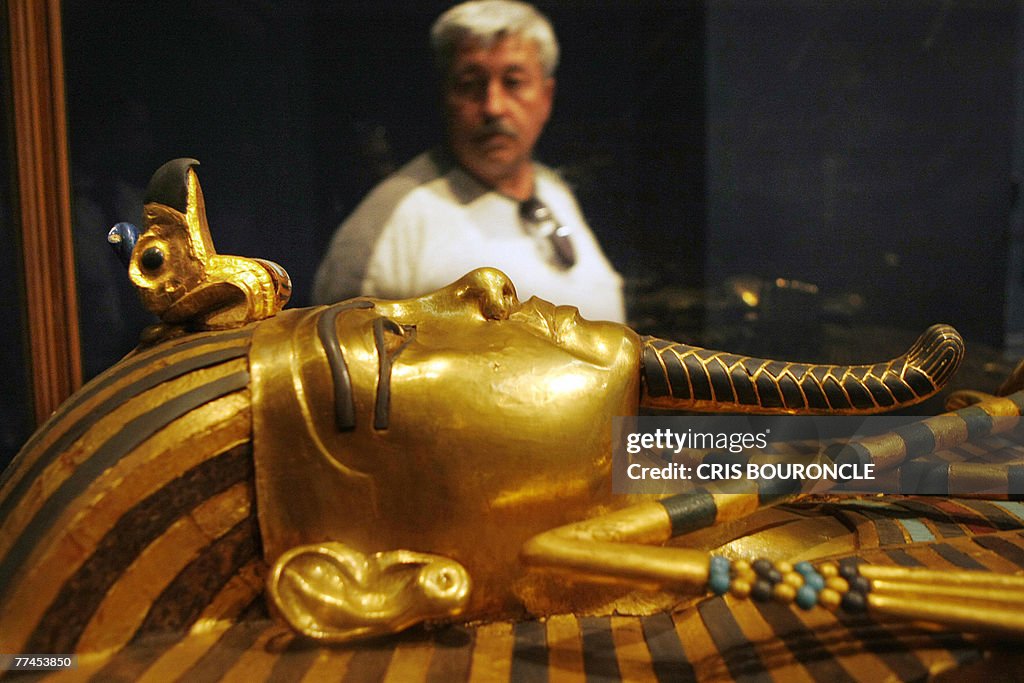 A visitor observes one of King Tutankham