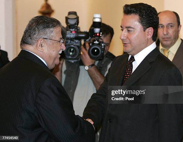 Turkish Foreign Minister Ali Babacan shakes hands with Iraq's President Jalal Talabani during a meeting on October 23, 2007 in Baghdad, Iraq. Babacan...