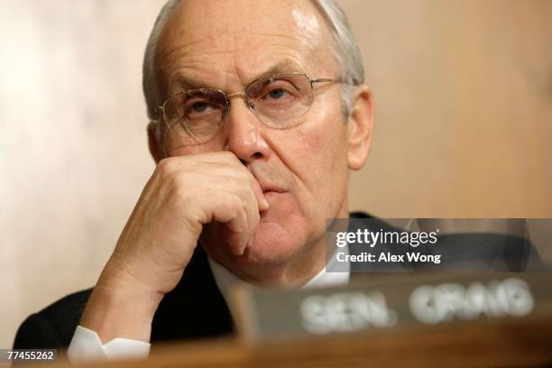 Sen. Larry Craig listens during a hearing on the impacts of global warming on public health before the Senate Committee on Environment and Public...