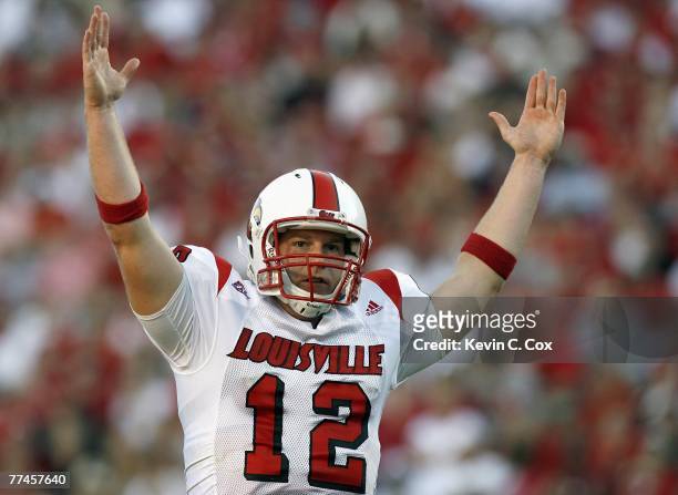 Quarterback Brian Brohm of the Louisville Cardinals signals a touchdown during the game against North Carolina State at Carter-Finley Stadium...