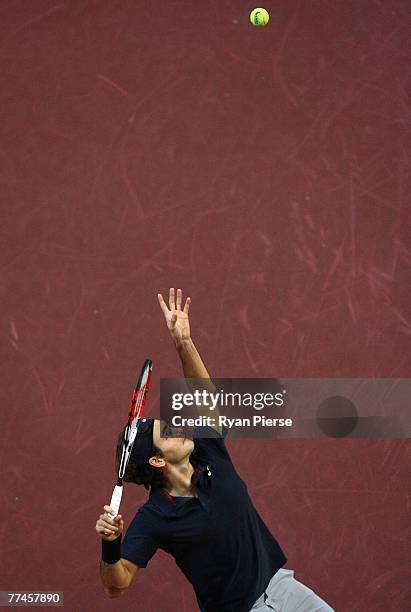 Roger Federer of Switzerland serves during his first round singles match against Michael Berrer of Germany during Day One of the ATP Davidoff Swiss...
