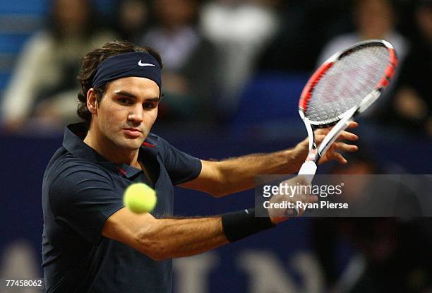Roger Federer of Switzerland hits a backhand during his first round singles match against Michael Berrer of Germany during Day One of the ATP...