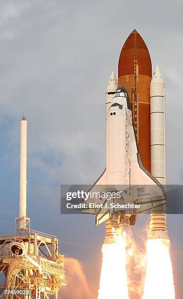 Space shuttle Discovery lifts off from launch pad 39A at the Kennedy Space Center October 23, 2007 at Cape Canaveral, Florida. The shuttle will...