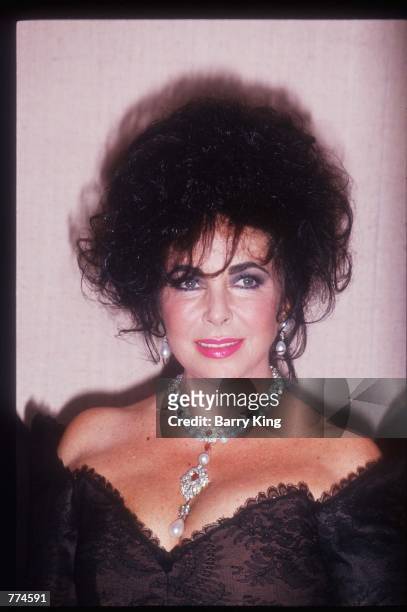 Actress Elizabeth Taylor stands January 19, 1992 in Los Angeles, CA. Taylor became a child star after her appearance in "National Velvet" and later...
