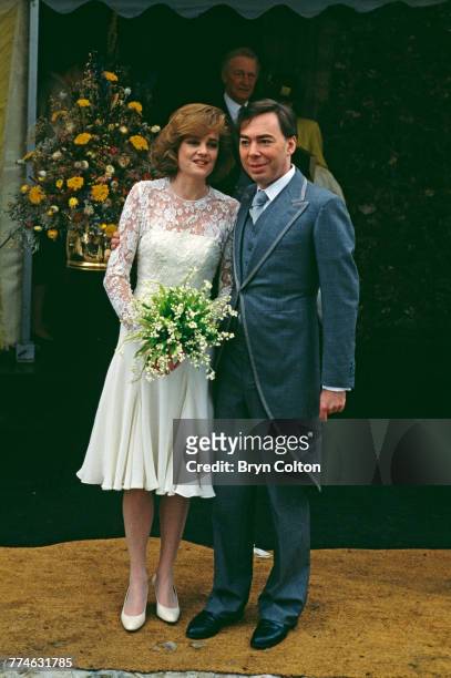 British composer and musical theatre impresario Andrew Lloyd Webber, with his wife, Madeleine Gurdon, outside Saint Botolph's Church following their...