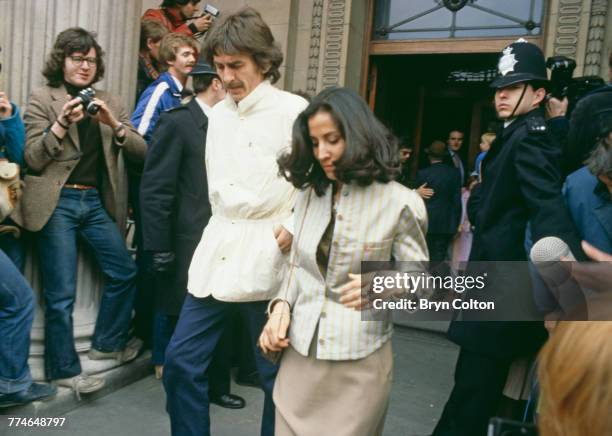 Former Beatle George Harrison and his wife Olivia Harrison, leaving Marylebone Register Office after the wedding ceremony of fellow Beatle Ringo...