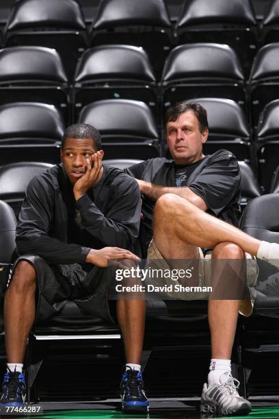 Rashad McCants and Vice President of Basketball Operations Kevin McHale of the Minnesota Timberwolves watch morning practice prior to the preseason...