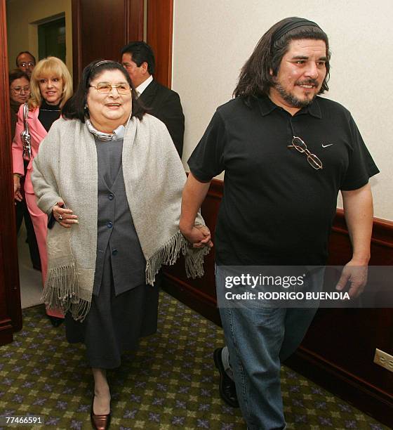 Argentine singer Mercedes Sosa walks with her son Fabian Matus upon their arrival to a hotel 23 October, 2007 in Quito. Sosa will present her show...