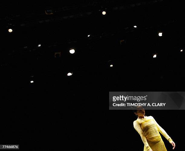 Dancer Yanni Yin with the Ballet Du Grand Theatre De Geneve performs "Para-Dice" during a dress rehearsal before opening night 23 October 2007 at the...