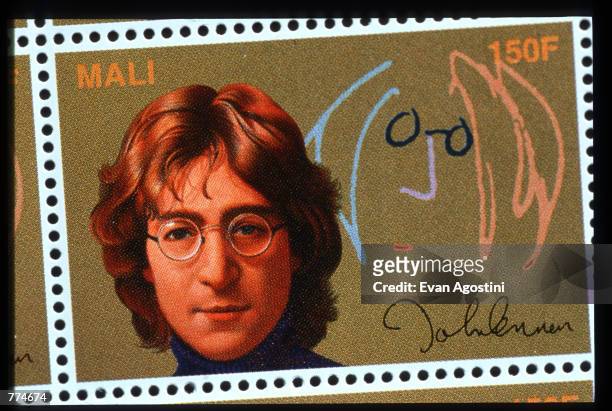 Portrait stamps of singer John Lennon are displayed January 4, 1996 in USA. The commemorative stamp collection designed by renowned artist Yuan Lee...