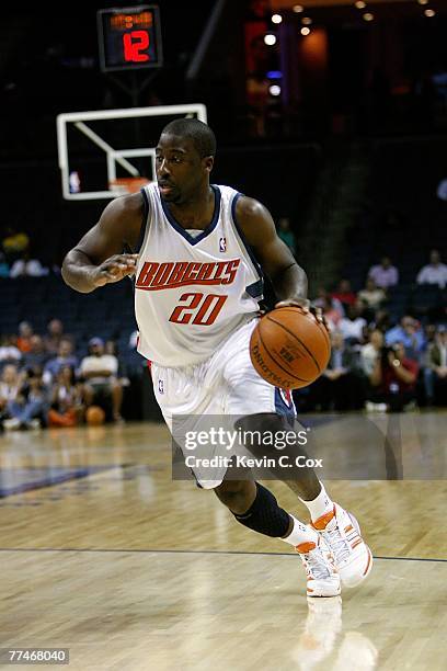 Raymond Felton of the Charlotte Bobcats drives to the basket during the game against the New Jersey Nets at Charlotte Bobcats Arena on October 15,...