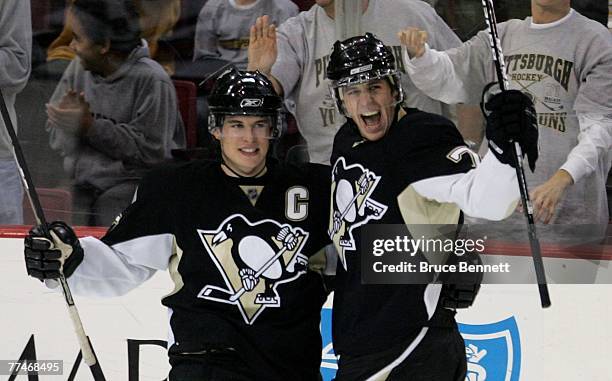 Sidney Crosby of the Pittsburgh Penguins celebrates a goal by Evgeni Malkin at 44 seconds of the second period against the New York Rangers on...