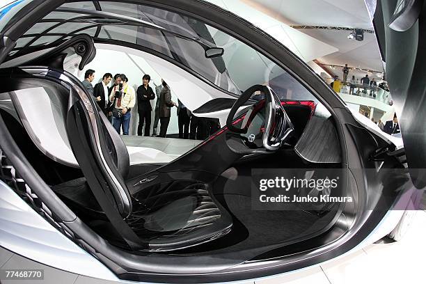 Mazda's concept car "Taiki" is on display along with other vehicles for the press day of the 40th Tokyo Motor Show at Makuhari Messe on October 24,...