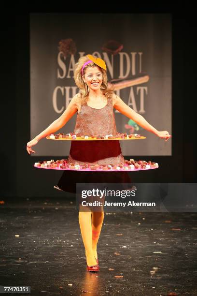 French singer Najoua Belyzel displays a chocolate decorated dress created by fashion designer Agatha Ruiz de la Prada and chocolate maker Leonidas,...