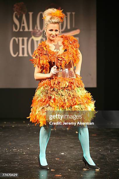 French singer Charlotte Marin displays a chocolate decorated dress created by fashion designer Alexandre Barthet and chocolate maker Franck Daubos,...