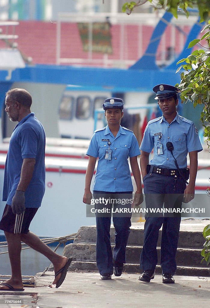 Maldivian police patrol at the waterfron