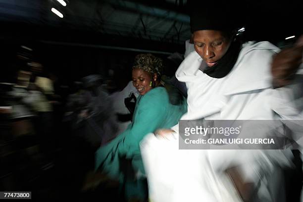 People from the Isaiah Shembe church sing and dance, 24 October 2007, during the memorial service for South African reggae musician Lucky Dube,...