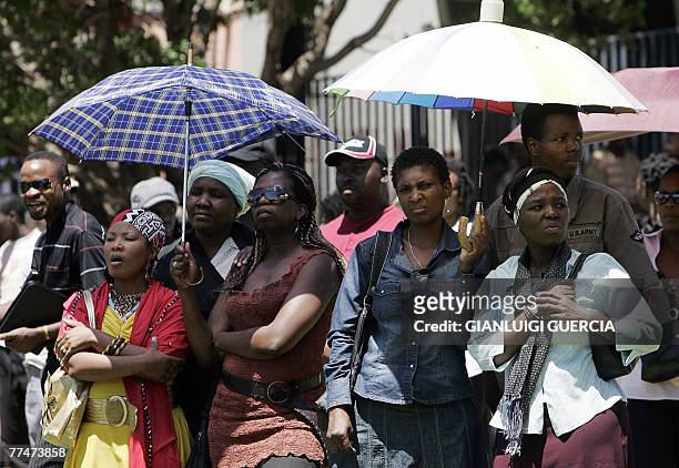 Hundreds of people attend, 24 October 2007, the memorial service for South African reggae musician Lucky Dube, murdered last week in an attempted...