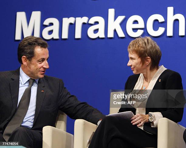 French President Nicolas Sarkozy speaks with head of the Medef employers' union Laurence Parisot at a French and Moroccan businessmen meeting in...