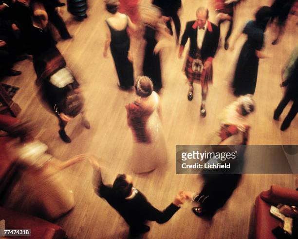 The Queen dancing at the Ghillies Ball at Balmoral Castle, Scotland during the Royal Family's annual summer holiday in September 1971. Part of a...