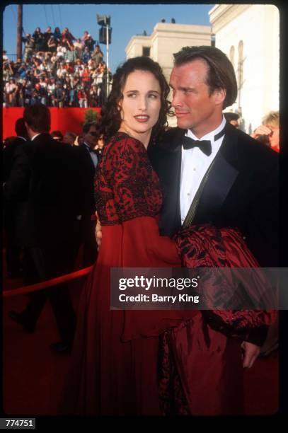 Actress Andie MacDowell stands with her husband at the sixty-seventh Academy Awards March 27, 1995 in Los Angeles, CA. After nearly three-quarters of...