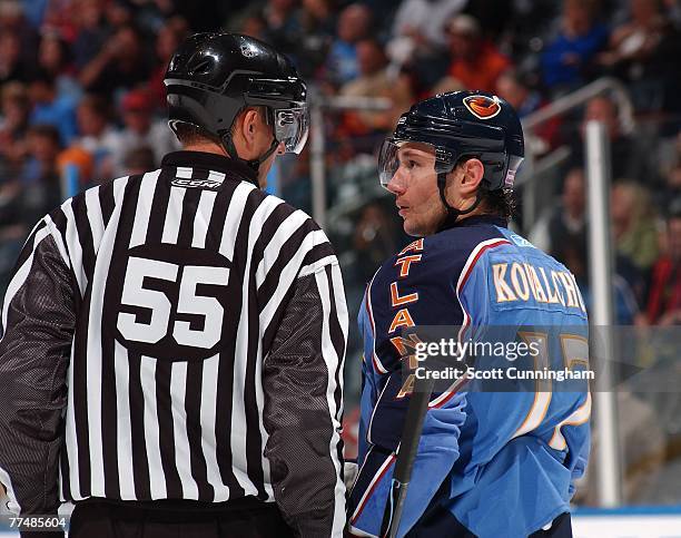 Ilya Kovalchuk of the Atlanta Thrashers discusses a play with linesman Shane Heyer during the game against the New Jersey Devils at Philips Arena on...