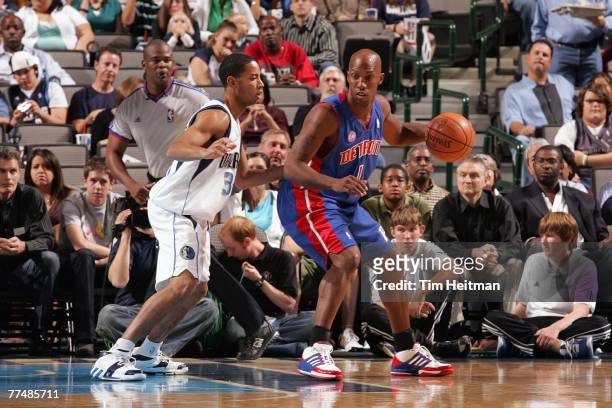 Chauncey Billups of the Detroit Pistons moves the ball against Devin Harris of the Dallas Mavericks during a preseason game at American Airlines...