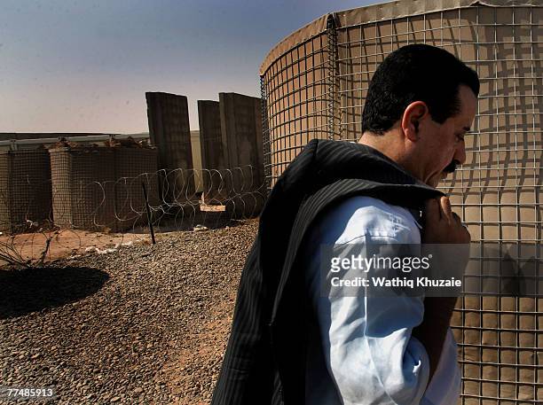 Tribal leader Kanian Al-Sadid, poses for photos at Cob Speicher on October 4, 2007 in the city of Tikrit in Salah Addin province about 110 miles...