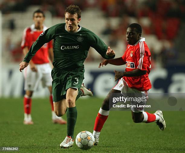 Lee Naylor of Celtic avoids Freddy Adu of Benfica during the UEFA Champions League Group D match between Benfica and Celtic at the Luz Stadium on...