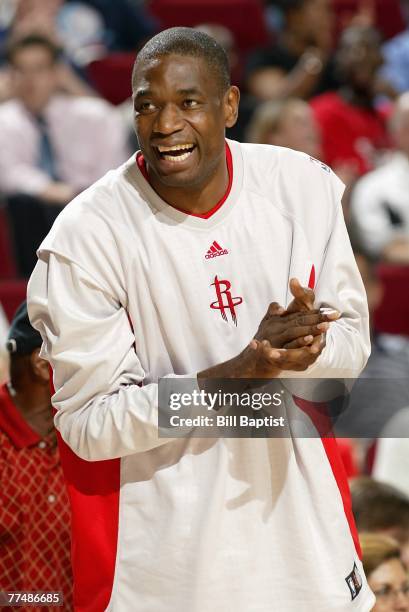 Dikembe Mutombo of the Houston Rockets reacts to a play during the game against the Dallas Mavericks at the Toyota Center on October 18, 2007 in...