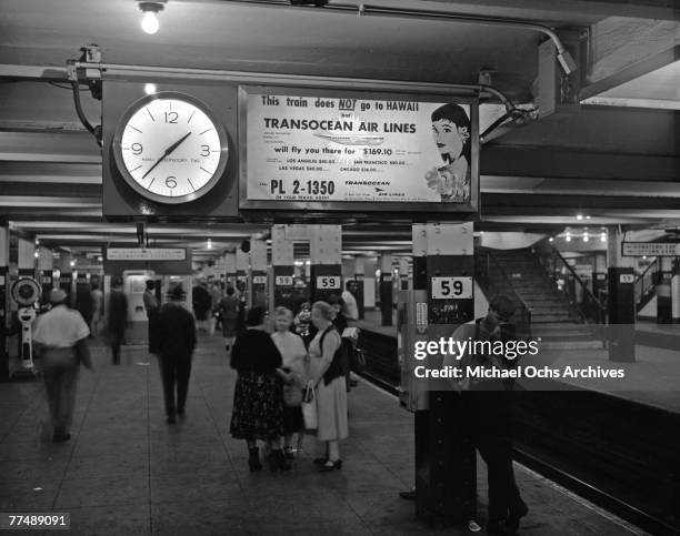 S: An advertisement for Transocean Air lines in a subway station in New York City, New York in the mid 1950's. Transocean Air lines flew between 1946...