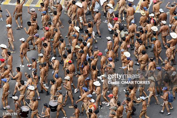 Peasants members of the "400 Pueblos" movement strip off to stand a protest against the dispossession of their lands in the state of Veracruz,...