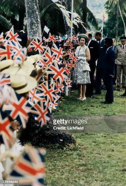 The Queen on a walkabout on the Seychelles in March 1972. Part of a series of photographs taken for use during the Silver Wedding Celebrations in...