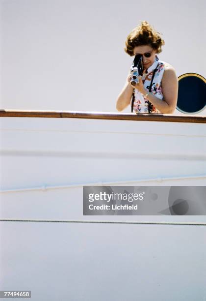 The Queen filming on board HMY Britannia in March 1972. Part of a series of photographs taken for use during the Silver Wedding Celebrations in 1972....