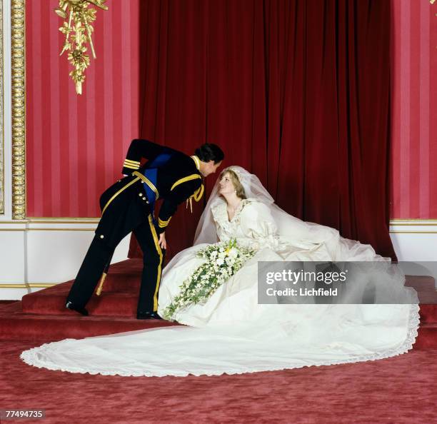 The Prince of Wales bending towards HRH The Princess of Wales after their wedding in the Throne Room at Buckingham Palace on 29th July 1981. .