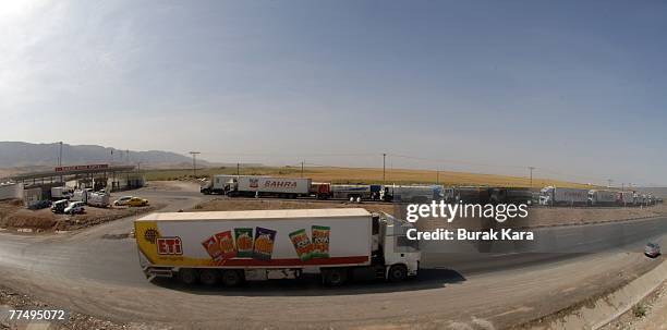 Turkish trucks wait to cross Turkey's Habur border gate to Iraq, on October 25, 2007 in Sirnak, Turkey. There is growing anxiety in the region about...