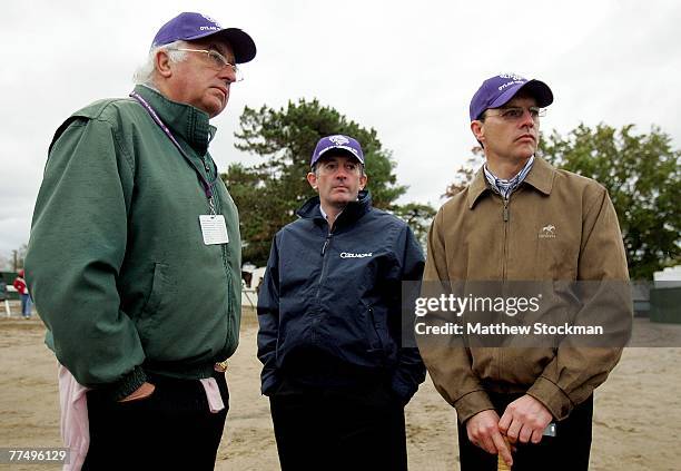 Owner John Magnier of Ireland, John Halley and Aidan O'Brien of Ireland trackside during morning workouts on October 25, 2007 in preparation for the...