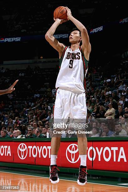 Yi Jianlian of the Milwaukee Bucks shoots during the game against the Minnesota Timberwolves at the Bradley Center on October 20, 2007 in Milwaukee,...