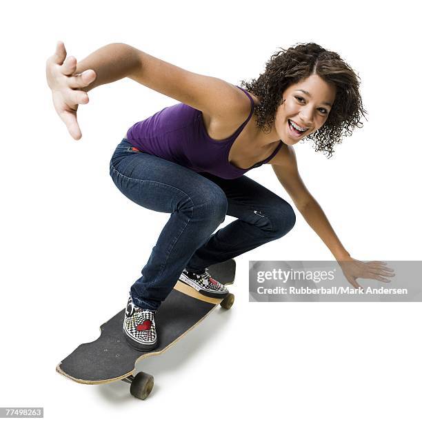 girl with braces on skateboard smiling - sports equipment isolated stock pictures, royalty-free photos & images