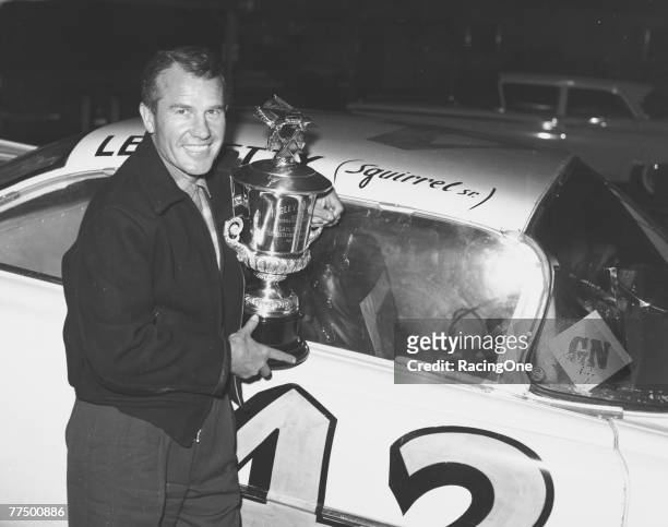 Lee Petty driver of the Oldsmobile poses in front of his car after winning the first 1959 Winston Cup Daytona 500 race at the Daytona International...