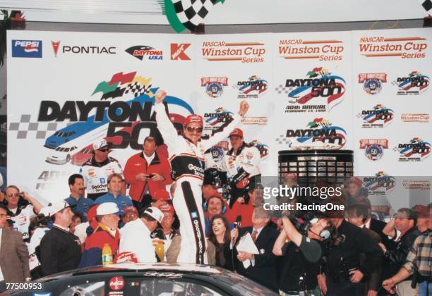 Dale Earnhardt Sr. Driver of the GM Goodwrench Chevrolet celebrates in victory lane after winning the 1998 NASCAR Winston Cup Daytona 500 at the...