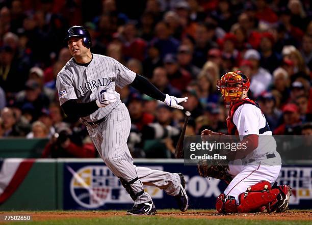 Matt Holliday of the Colorado Rockies hits a double against the Boston Red Sox in Game Two of the 2007 Major League Baseball World Series at Fenway...
