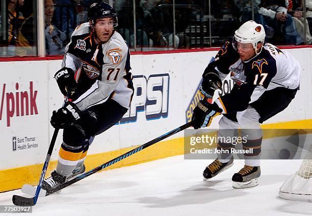 Dumont of the Nashville Predators protects the puck from Ilya Kovalchuk of the Atlanta Thrashers at the Sommet Center October 25, 2007 in Nashville,...