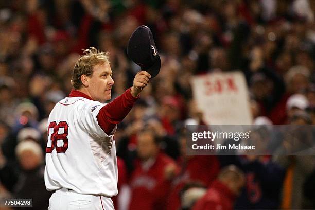 Curt Schilling of the Boston Red Sox tips his hat to the crowd as he comes out of the game in the sixth inning against the Colorado Rockies during...