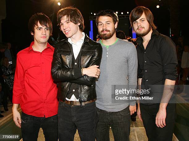 Members of the band Panic! at the Disco frontman Brendon Urie, guitarist Ryan Ross, bassist Jon Walker and drummer Spencer Smith, pose at a...