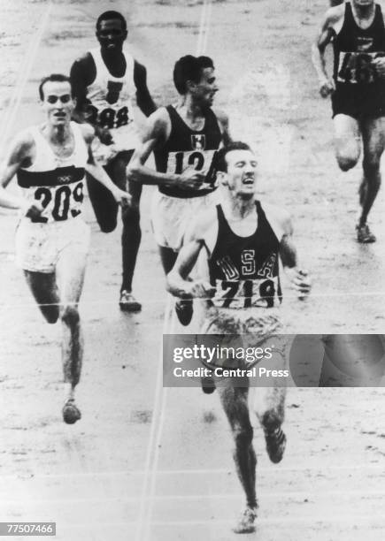 The final of the Men's 5000 Metres at the Tokyo Olympics, 1st October 1964. American athlete Bob Schul wins the gold medal and West Germany's Harald...