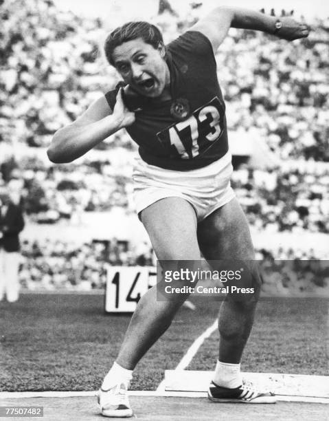 Soviet athlete Tamara Press wins the gold medal in the shot put and sets a new Olympic record for the event, during the Rome Olympics, 3rd September...