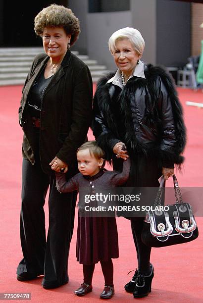 Carla and Anna Fendi, the daughters of Edoardo Fendi, who founded the Italian fashion house Fendi, pose with their niece Annabelle before the...