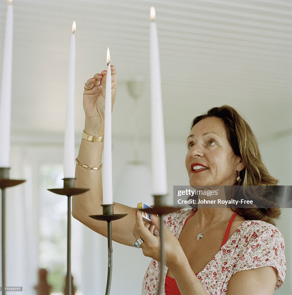 Woman lightning candles.