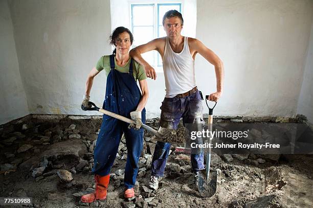 scandinavian couple renovating the floor in a room oland sweden. - sledge hammer stock pictures, royalty-free photos & images